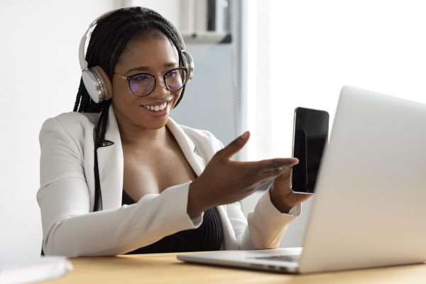 medium-shot-woman-holding-smartphone